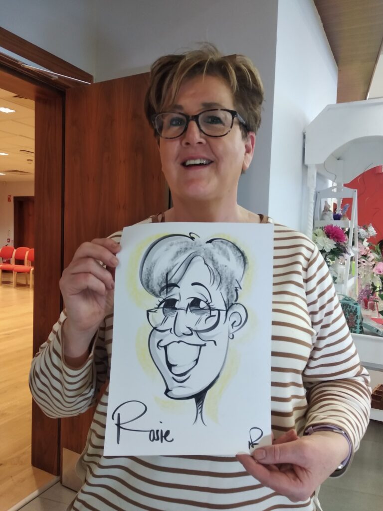 Woman holding a caricature drawing